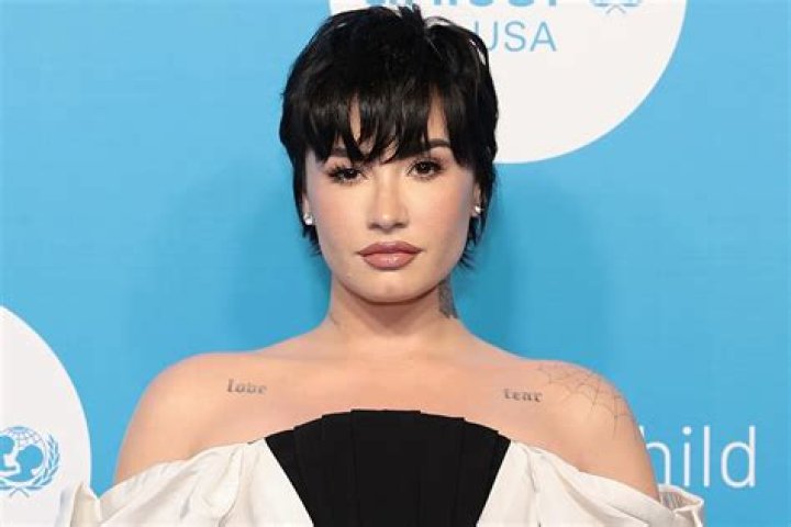 
Demi Lovato Shines in Elegant Off-the-Shoulder Gown That Showcases Her ‘Love’ and ‘Fear’ Tattoos 