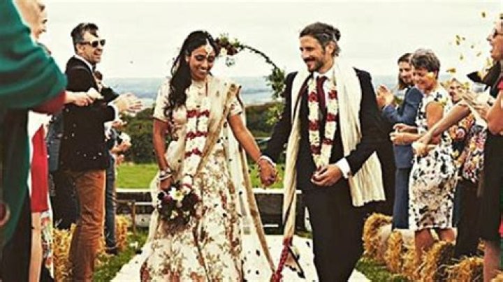 
Photos of Isa Guha and Richard Thomas’s wedding and family life 